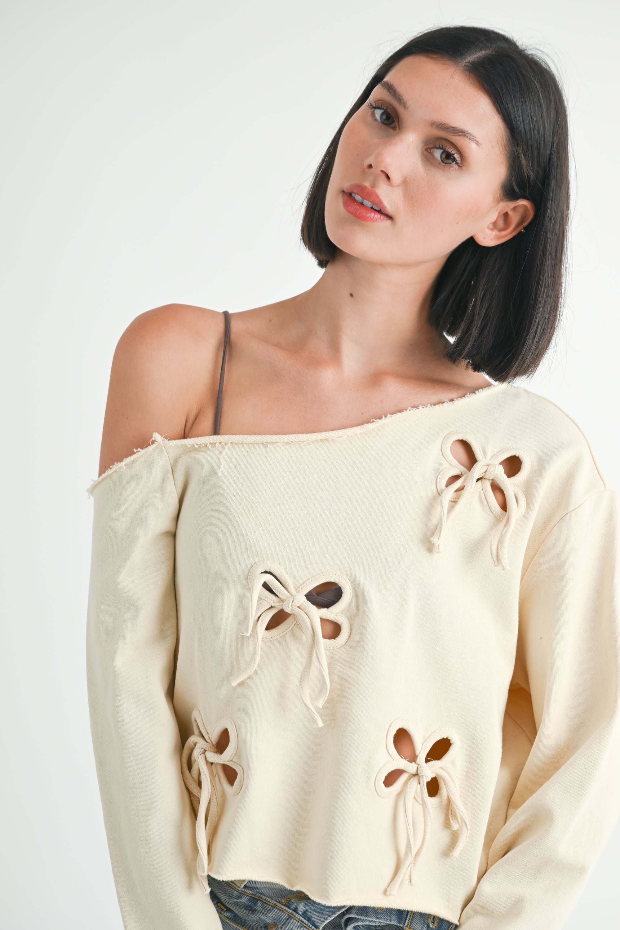 Off Shoulder Top - ivory with cutout bow design, women's sweatshirt collection